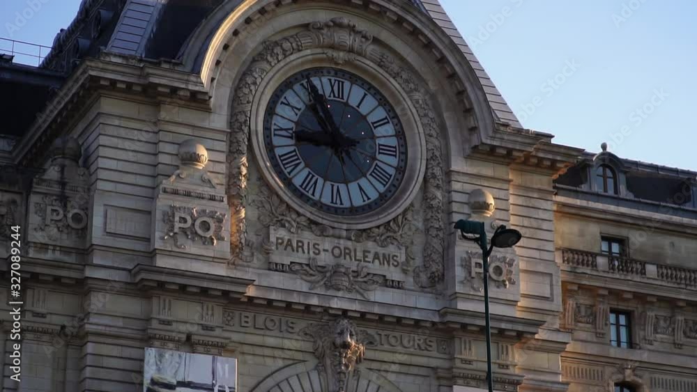 Historic clock on building facade. Musée d'Orsay. Glide shot. Paris tourism attraction & famous landmark. Romantic honeymoon travel destination Historic clock on building facade. Musée d'Orsay. Glide shot. Paris tourism attraction & famous landmark. Romantic honeymoon travel destination