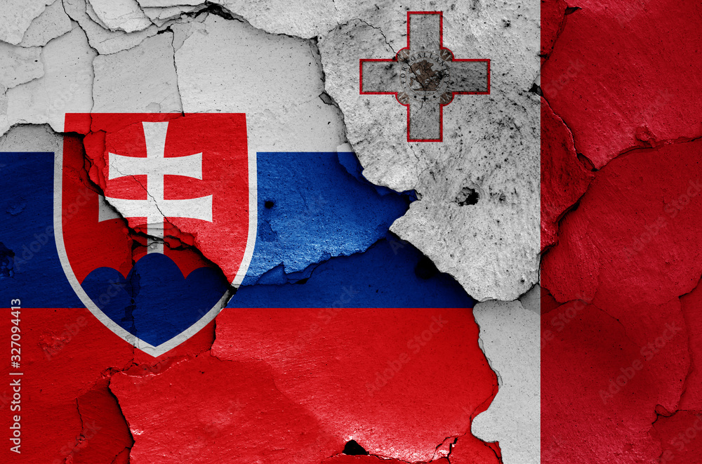flags of Slovakia and Malta painted on cracked wall flags of Slovakia and Malta painted on cracked wall