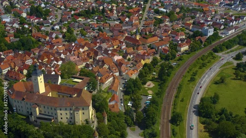 Aerial view from the city Gundelsheim and castle Horneck in Germany.  Camera pans left and then rotates right. View of castle with city in background. photo