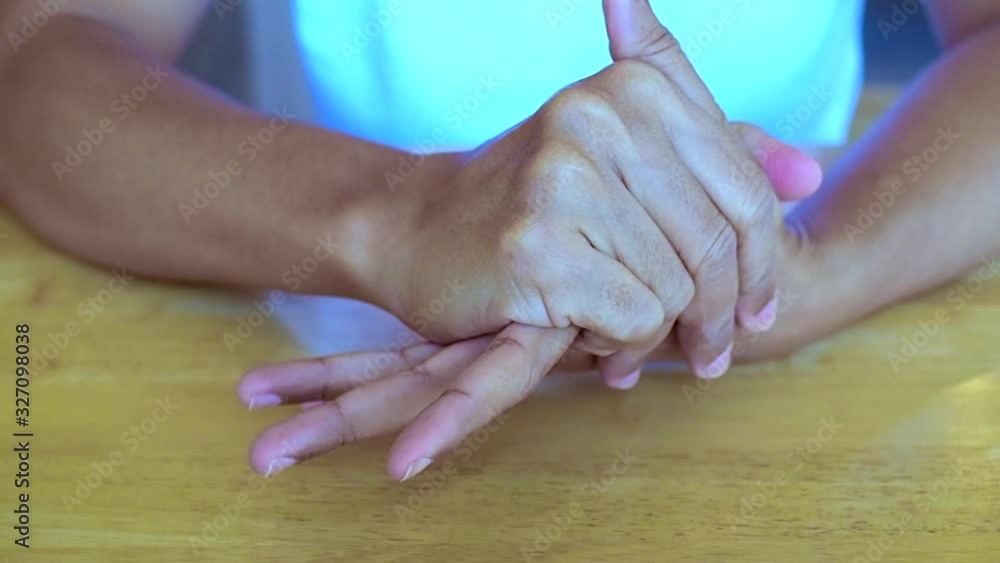 Hand exercise with massage to relax muscle on fingers and palms, Take care of health by exercising to relieve hand pain and cure illness. Hand exercise with massage to relax muscle on fingers and palms, Take care of health by exercising to relieve hand pain and cure illness.