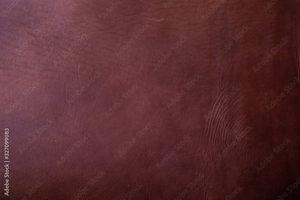 Abstract dark genuine brown vegetable tanned leather background Abstract dark genuine brown vegetable tanned leather background
