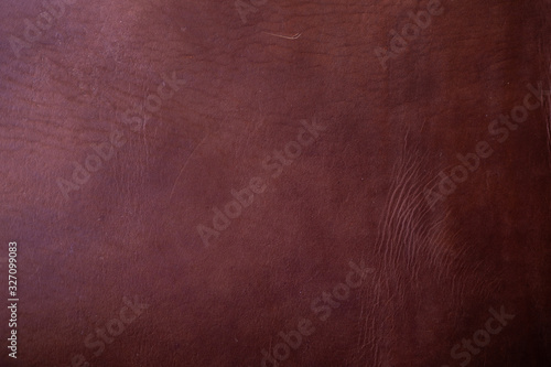 Abstract dark genuine brown vegetable tanned leather background
