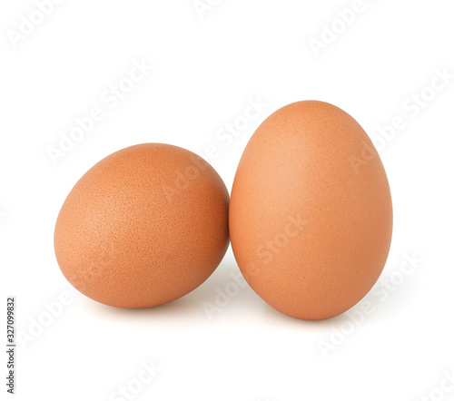 Raw chicken eggs isolated on the white background.