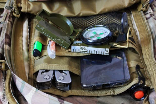 Phone and compass in a backpack