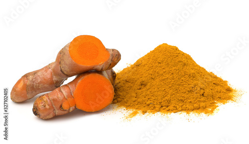 Turmeric (curcumin) rhizomes and powder isolate on a white background,Used for cooking and as herbal medicine