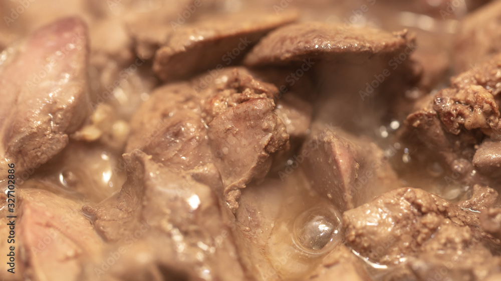 Chicken liver is fried in a pan. Chicken liver is fried in a pan.