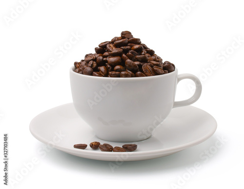 Roasted coffee beans in a white coffee mug isolated on white background.