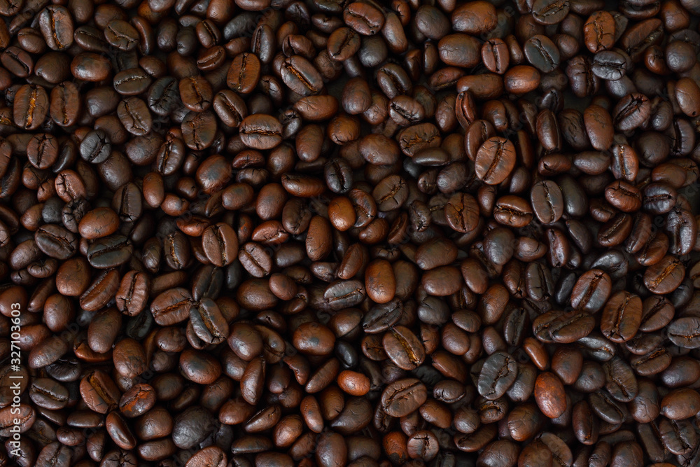Roasted coffee beans,Coffee bean background,Dark Roasted Coffee,top view. Roasted coffee beans,Coffee bean background,Dark Roasted Coffee,top view.