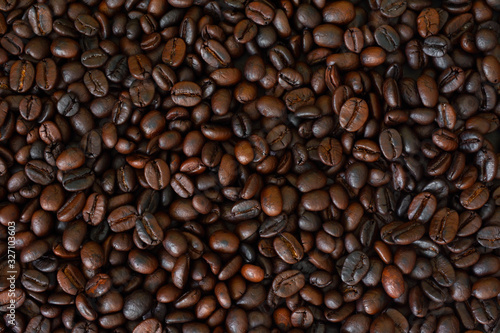 Roasted coffee beans Coffee bean background Dark Roasted Coffee top view.