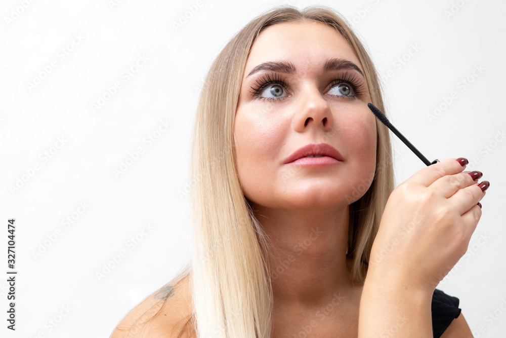 Beautiful blonde woman paints eyelashes. Beautiful female face. Makeup Read More Beauty girl with perfect skin. Makeup in progress Beautiful blonde woman paints eyelashes. Beautiful female face. Makeup Read More Beauty girl with perfect skin. Makeup in progress