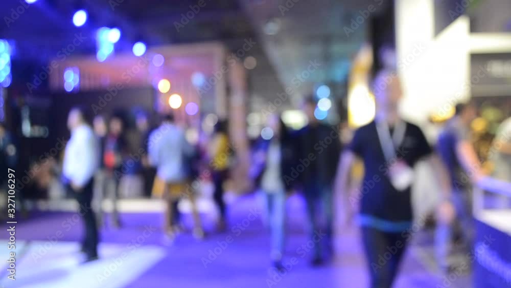 Blurred Background. People are standing behind counter in of purple hall. Blurred Background. People are standing behind counter in of purple hall.