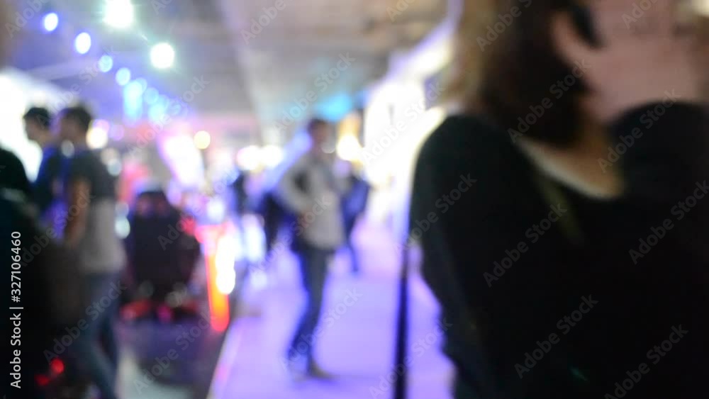 Blurred Background. People are standing behind counter in of purple hall. Blurred Background. People are standing behind counter in of purple hall.