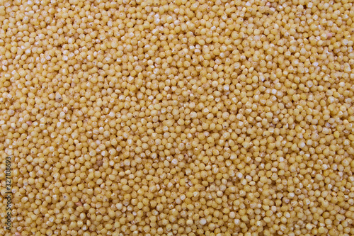 Organic concept.Polished millet texture and details traditional food.Millet texture pattern macro background.