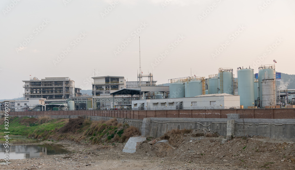 modern chemical plant at sunset modern chemical plant at sunset