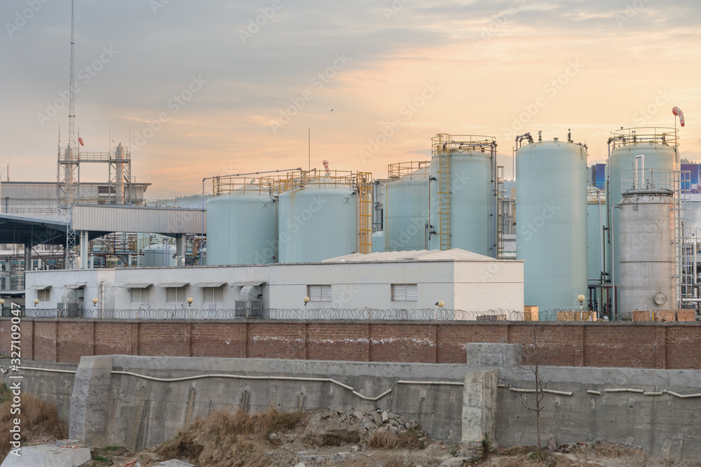 Fototapeta premium modern chemical plant at sunset