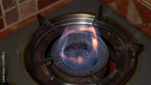 Gas burning flame on stove photo