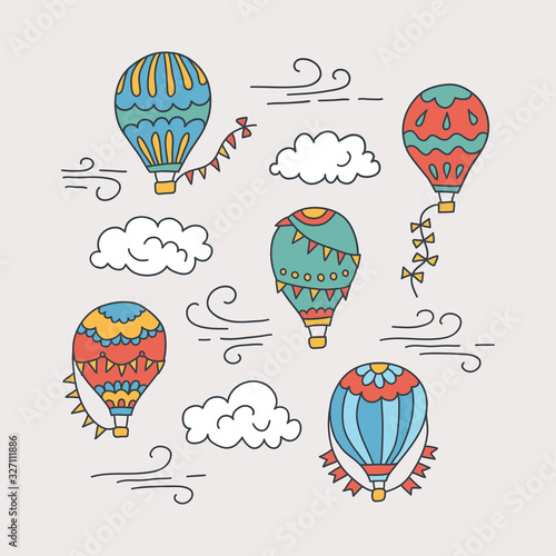 Hot air balloons and clouds. Color vector hand drawn doodle illustration