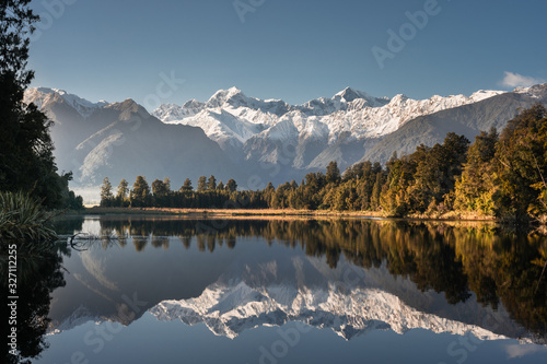 Lake matheson, South Island, New Zealand, with reflection of mount tasman and aoraki mount cook in winter