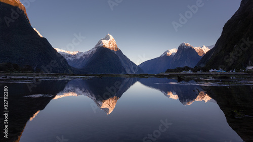 Obraz na płótnie Mirror reflection of Mitrepeak in Milford sound in the morning, south island, Ne