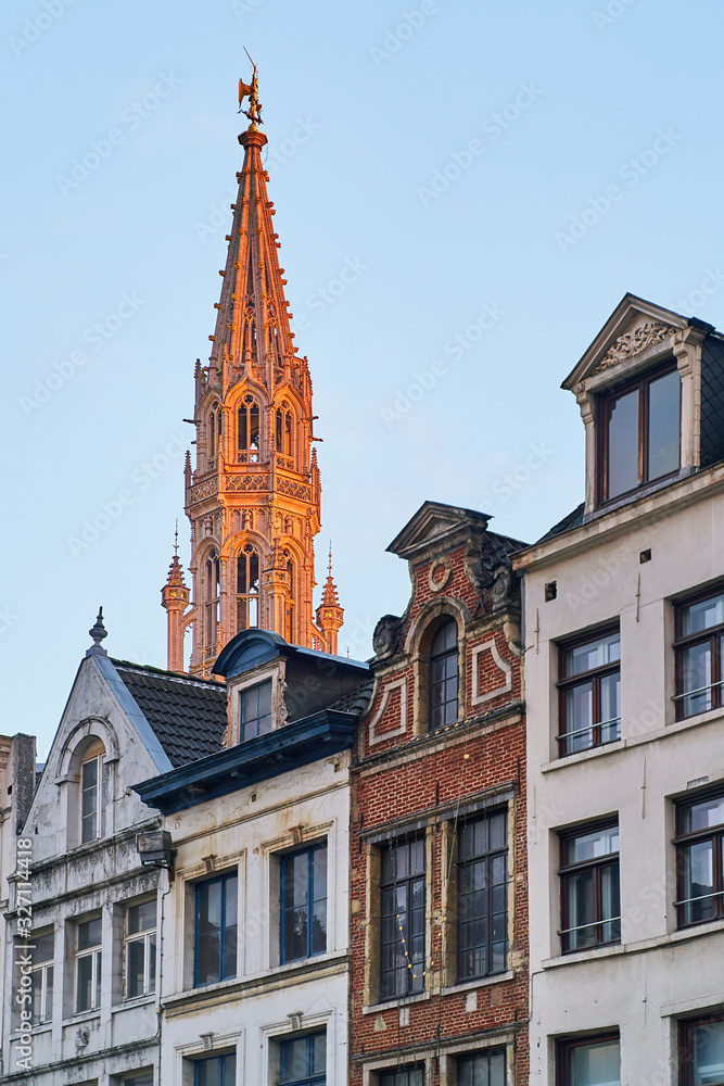 Brussels Town Hall tower capped in evening light.