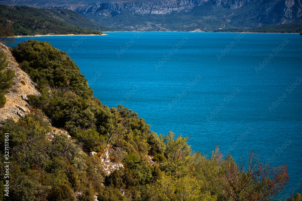 Scenic view with blue turquoise water, mountains and cliffs around of lake of Sainte-Croix, Gorges du Verdon, Verdon Gorge Provence-Alpes-Cote d'Azur, France. travel tourism destination Provence