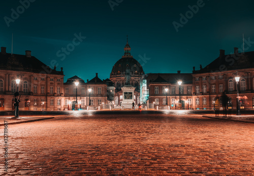 Photography Night long exposure panoramic view after rain of Amalienborg winter residence 18th-century rococo complex of palaces with museum & marches/displays by royal guards in Copenhagen, Denmark