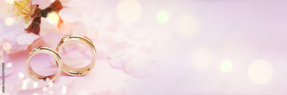 Spring background with blossom and wedding rings Spring background with blossom and wedding rings
