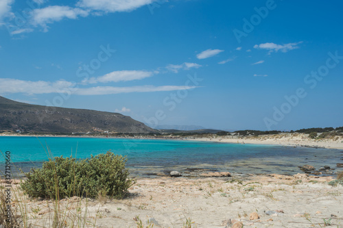 Beautiful beach with teal blue waters shot at Elafonhsos Island, Greece.