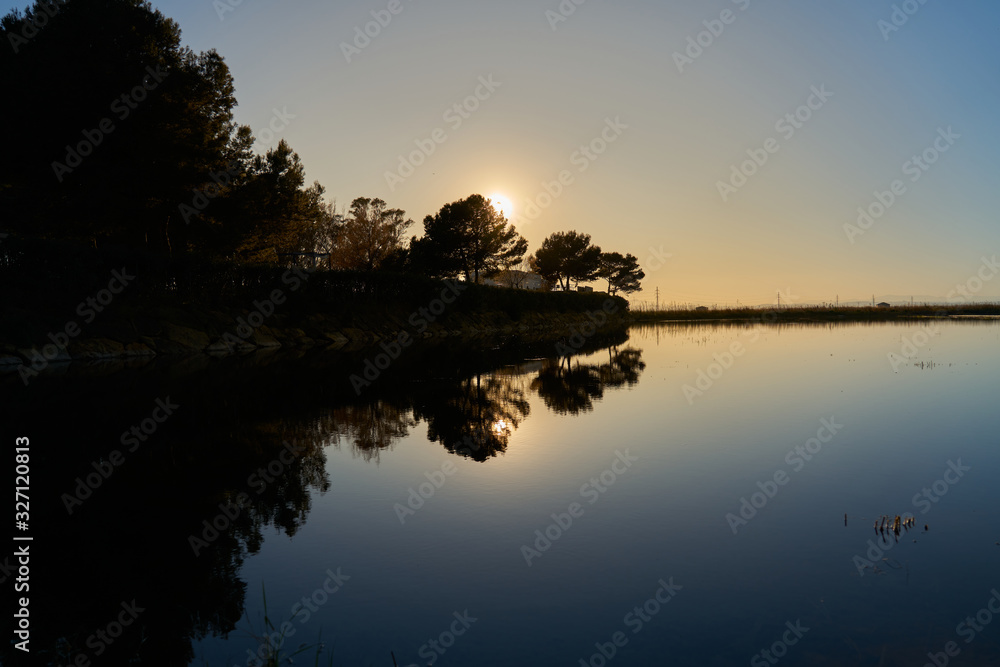 sunset over a water pond                     