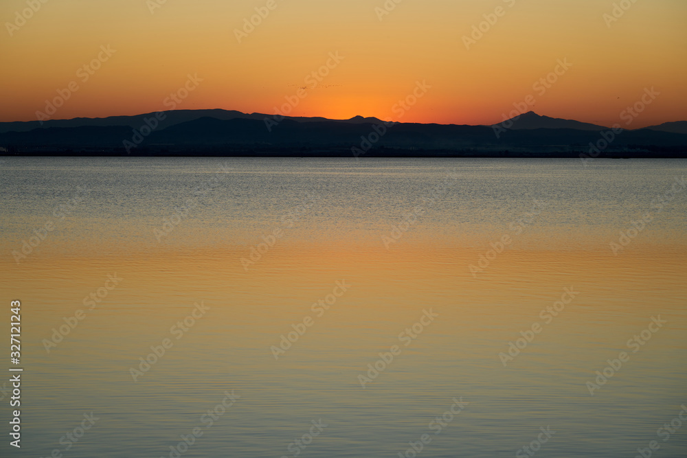 orange sunset on a lake 