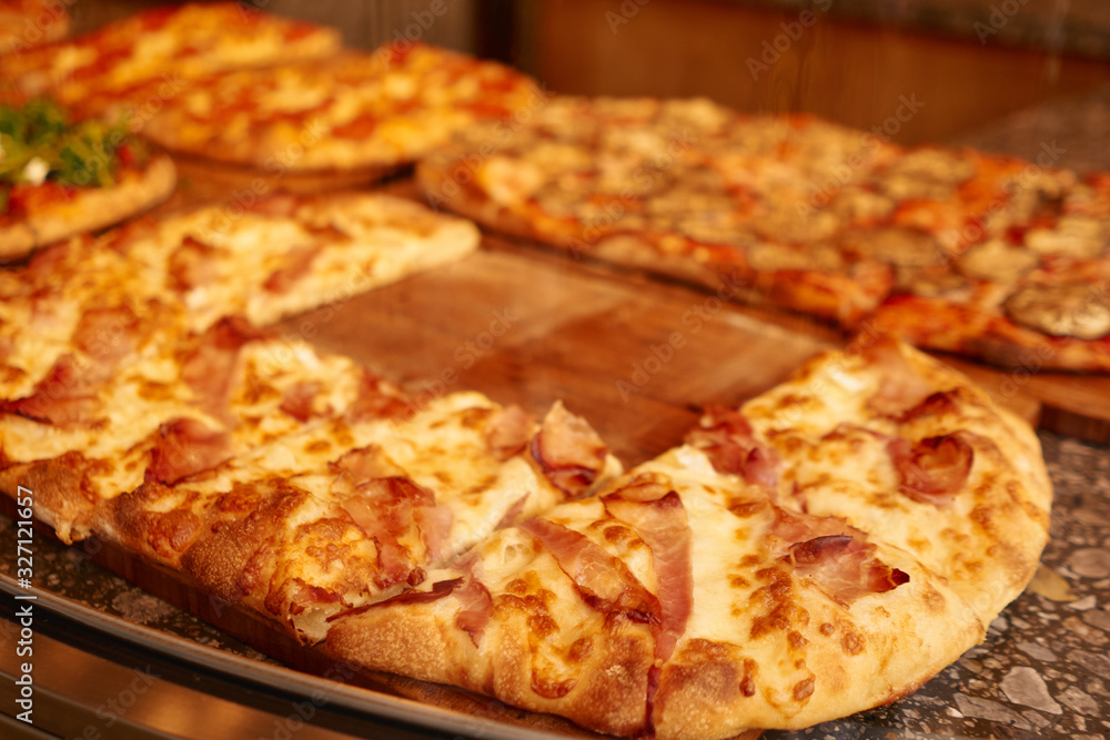 Classic italian fast food – delicious big pizza with ham and cheese Classic italian fast food – delicious big pizza with ham and cheese