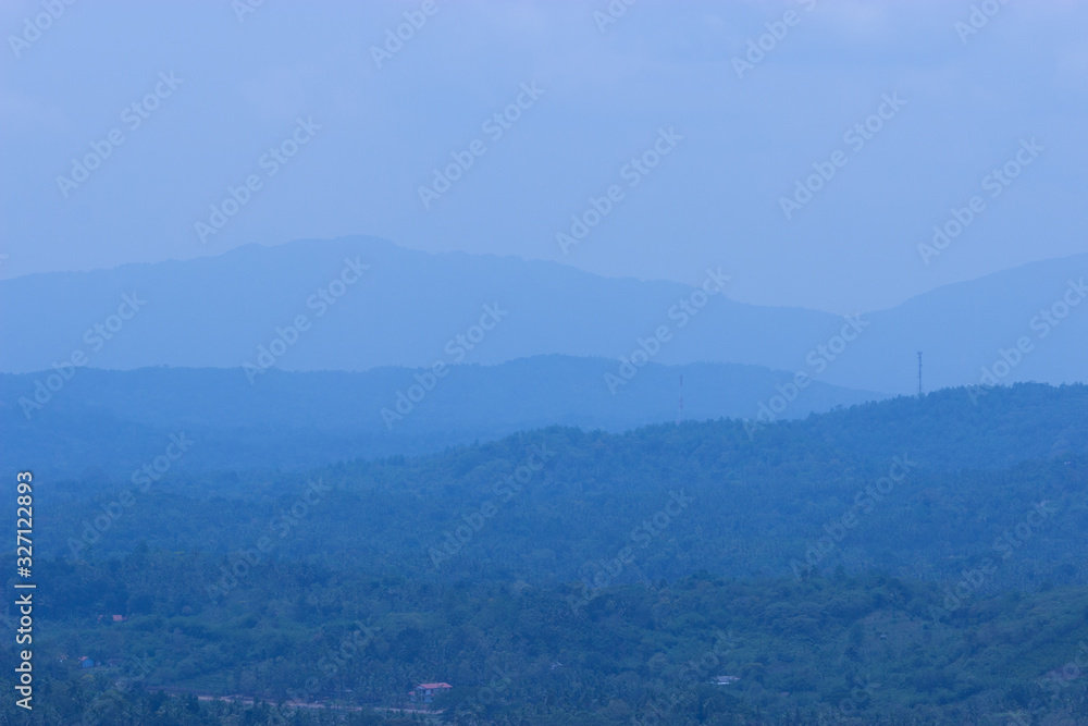Fototapeta premium Hills in blue mist