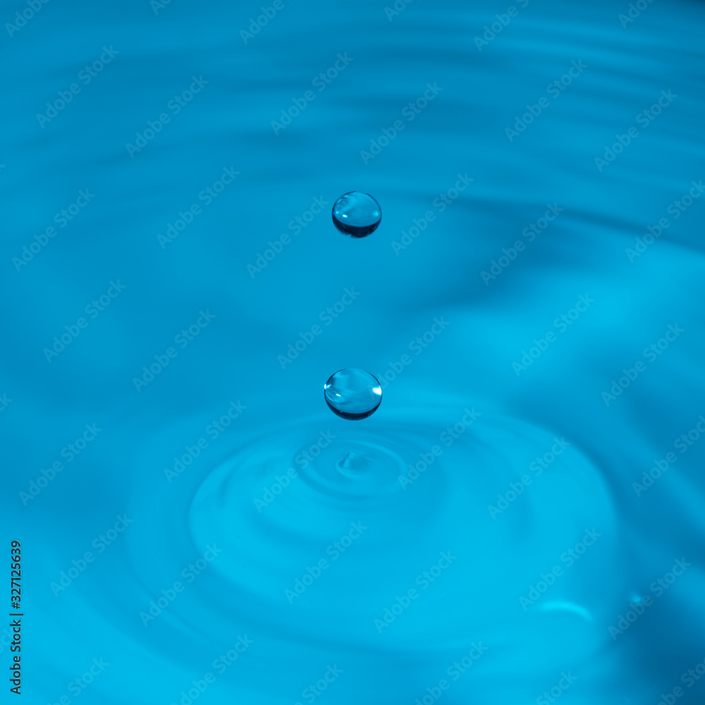 water drop bouncing on the surface of more water water drop bouncing on the surface of more water