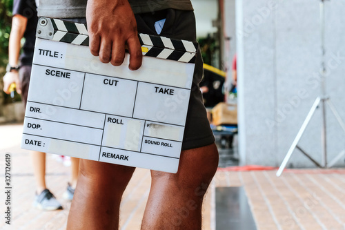 Film Slate, close up image of film production crew holding Film Slate on set photo