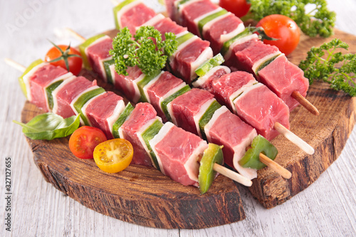 beef and bell pepper barbecue - skewer on wooden board