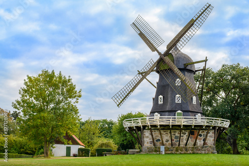 View of Old Windmill 'Slottsmollan' in the Kungsparken Park with beautiful clouds in the sky in Malmo, Sweden