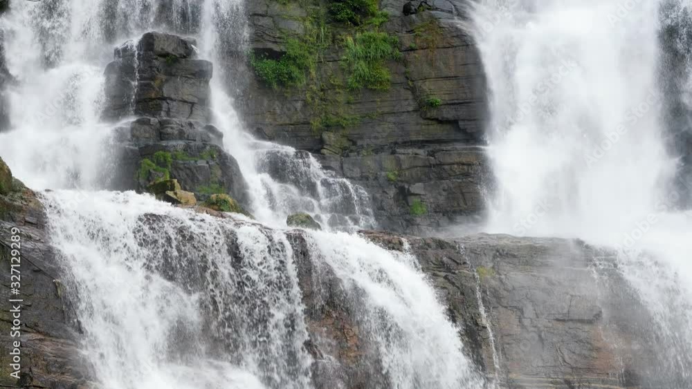 4k slow motion video of beautiful powerful waterfall cascade in the tropical rainforest of Sri Lanka 4k slow motion video of beautiful powerful waterfall cascade in the tropical rainforest of Sri Lanka