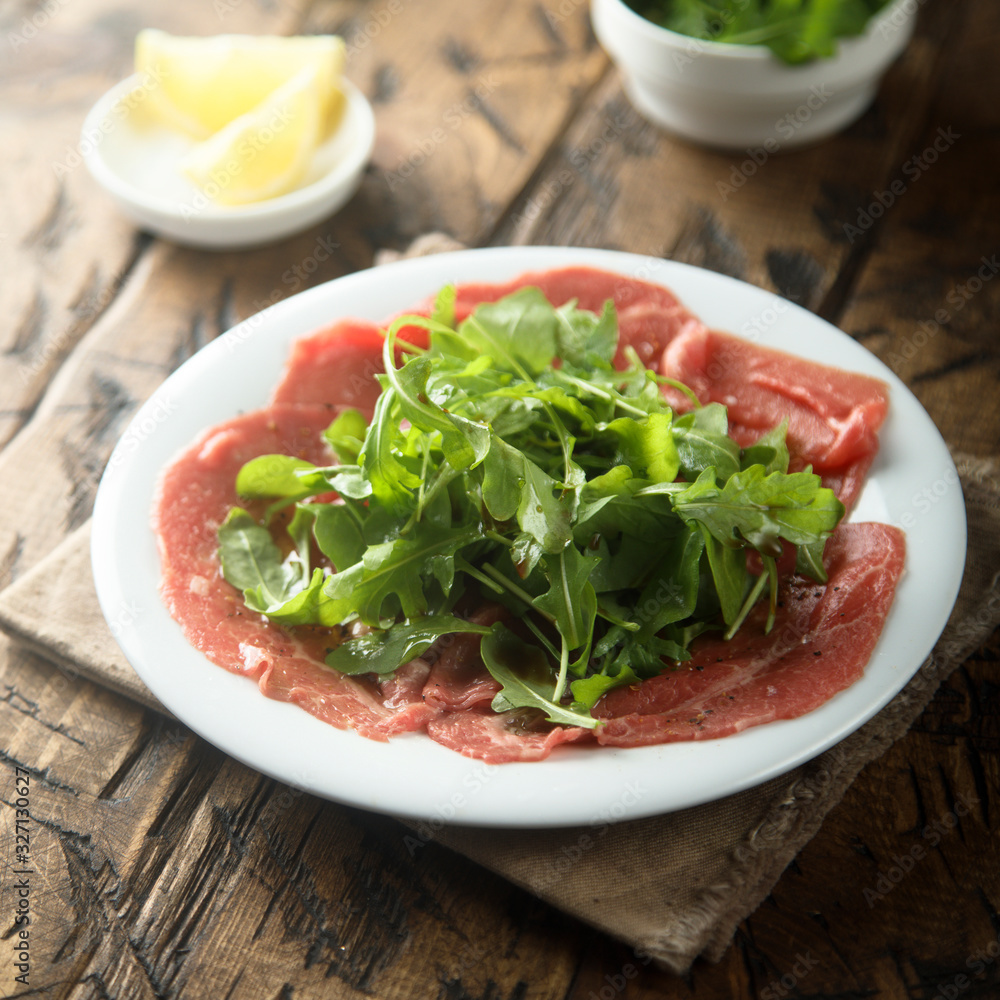 Beef carpaccio with arugula salad Beef carpaccio with arugula salad