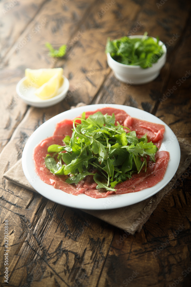Beef carpaccio with arugula salad Beef carpaccio with arugula salad
