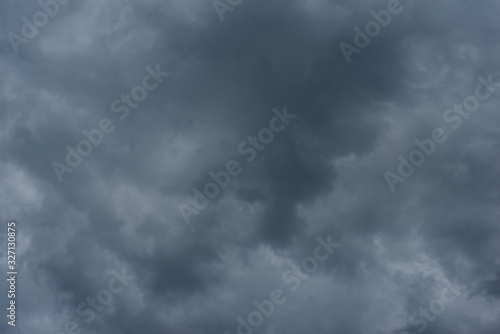 Dark black clouds in the sky, Stormy rain clouds background.
