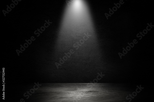 Empty space of Studio dark room black concrete wall and spotlight with concrete floor.