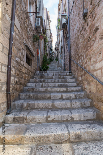 Narrow street with stone stairs in Dubrovnik old city center