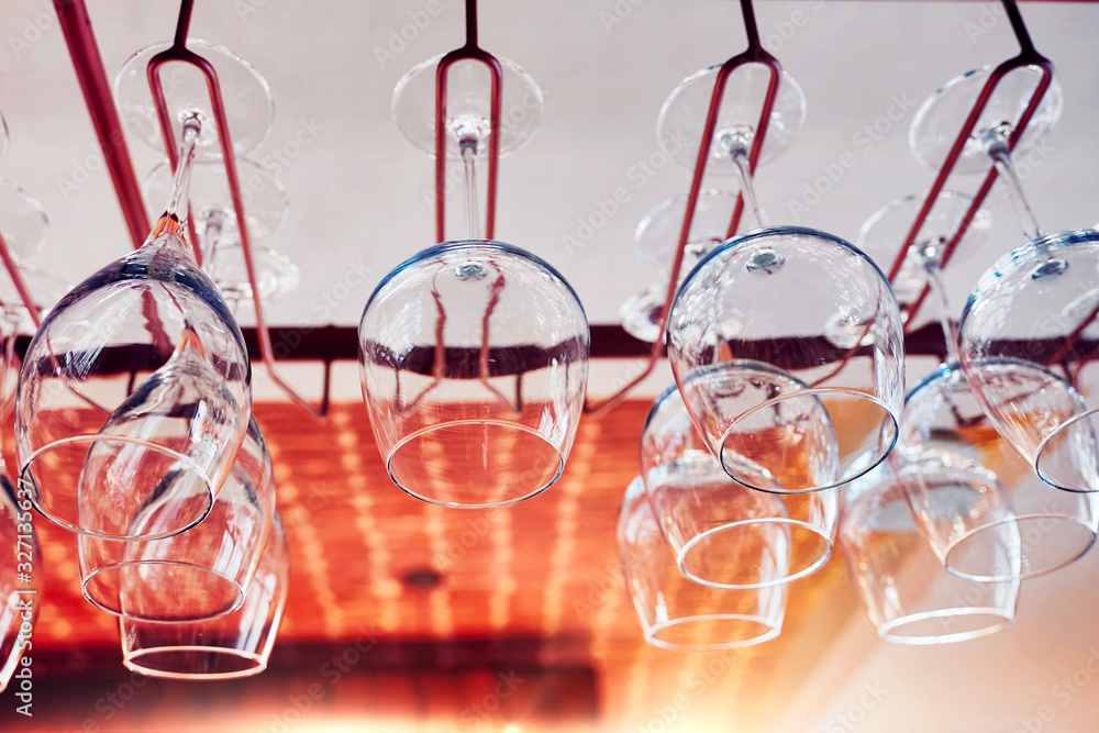 Wine glasses hanging on a bar rack Wine glasses hanging on a bar rack