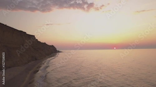 Aerial view obeautiful, landscape, nature, ocef a Sunrise sky background. Aerial Dramatic gold sunrise with morning sky clouds over the sea. Stunning sky clouds in the sunrise. Aerial videography. 4K. photo