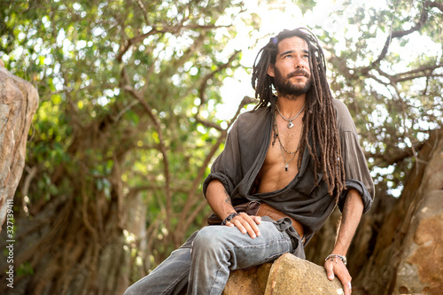 Canvas-taulu handsome guy with dreadlocks on an island in thailand