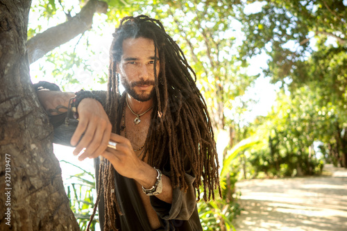 Canvas Print handsome guy with dreadlocks on an island in thailand
