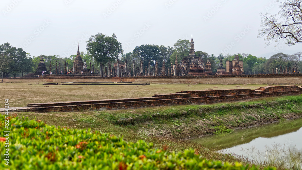 Ruins of Ancient Thai Temples. Famous Sukhothai Historical Park, a UNESCO World Heritage Site. The ancient capital of Sukhothai, Thailand