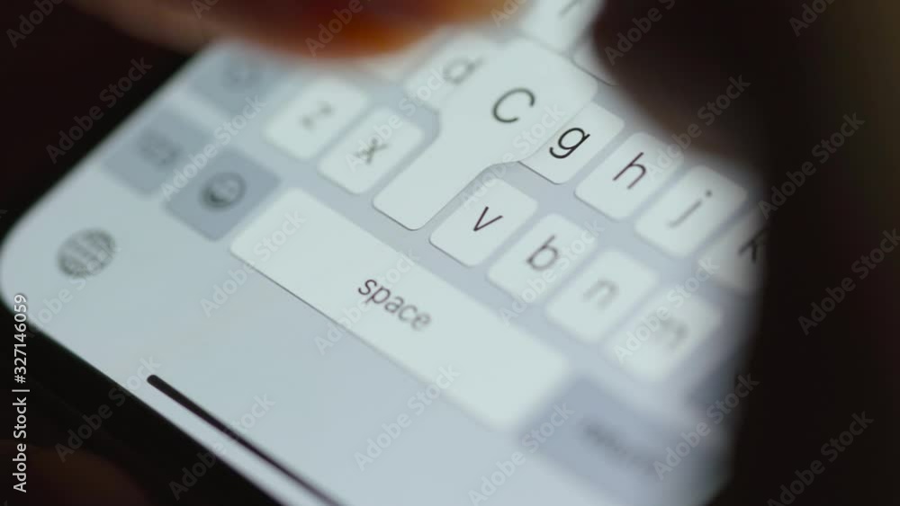 Hands typing text on smartphone close-up. Using smartphone close up at night. Hands typing text on smartphone close-up. Using smartphone close up at night.