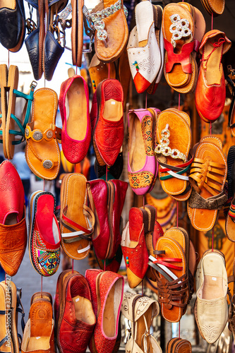 Traditional vibrant Moroccan slippers on the market.