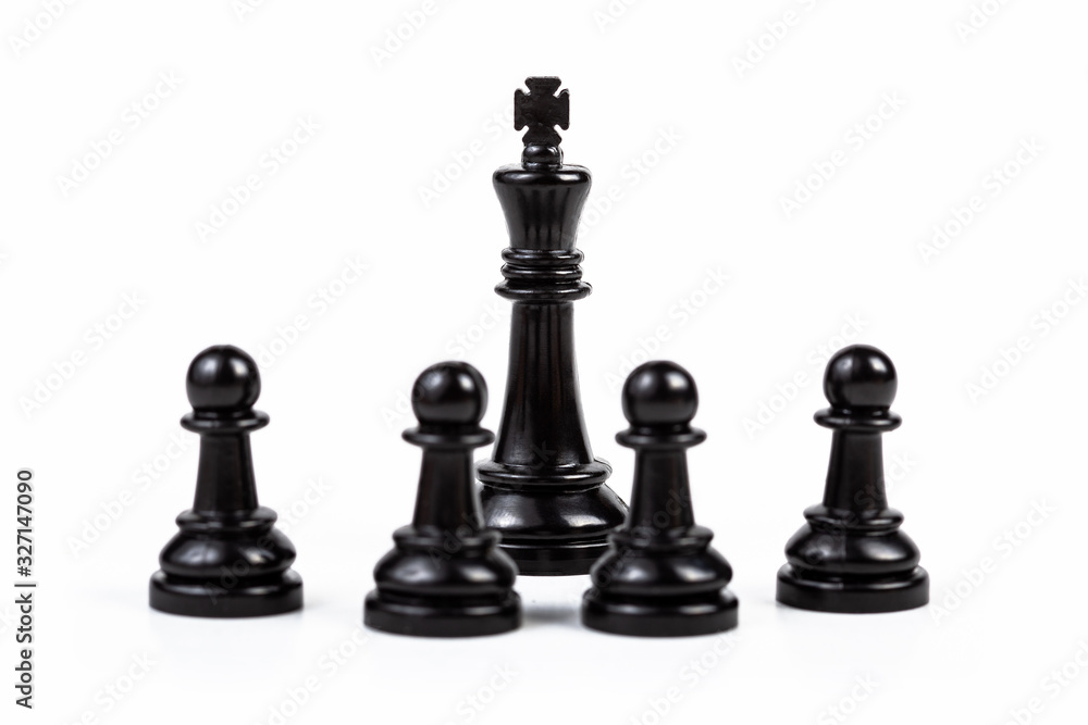 Black king chess piece surrounded by four pawns. People, group gathered around the ruler. Boss, leader, guru, authority, influence and crowd control, simple gathering and leadership abstract concept Black king chess piece surrounded by four pawns. People, group gathered around the ruler. Boss, leader, guru, authority, influence and crowd control, simple gathering and leadership abstract concept